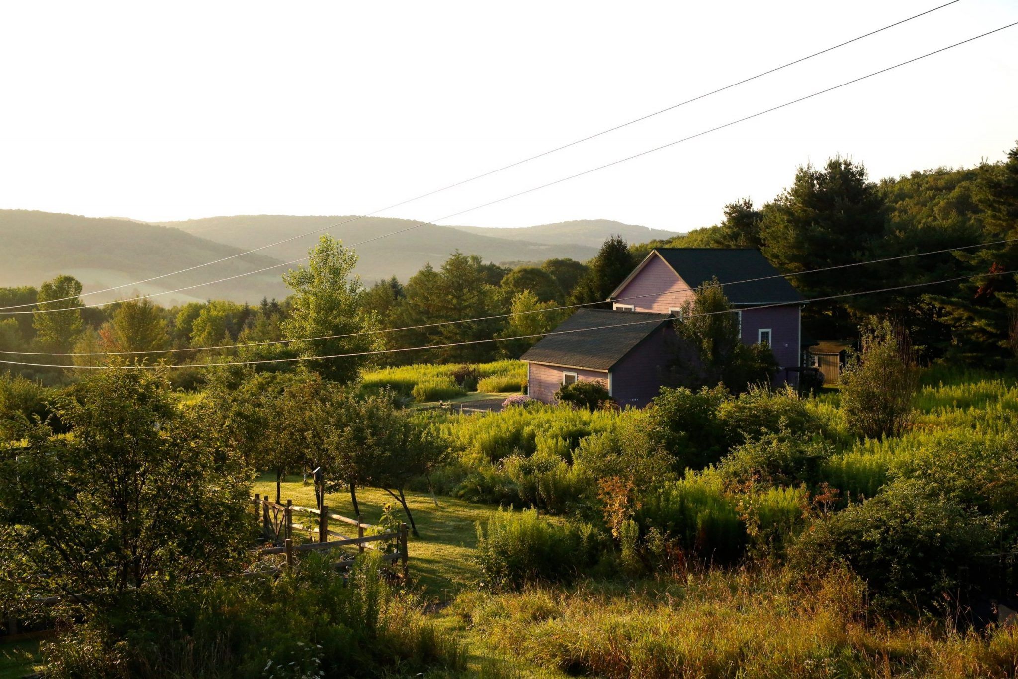 Heathen Hill Retreat Center purple country house on beautiful farm landscape