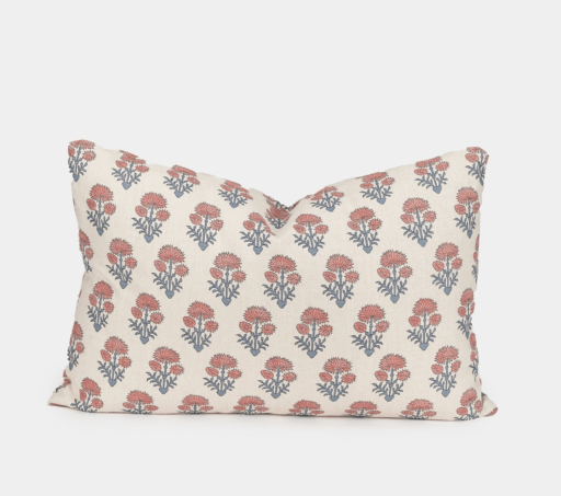 white pillow with flowers