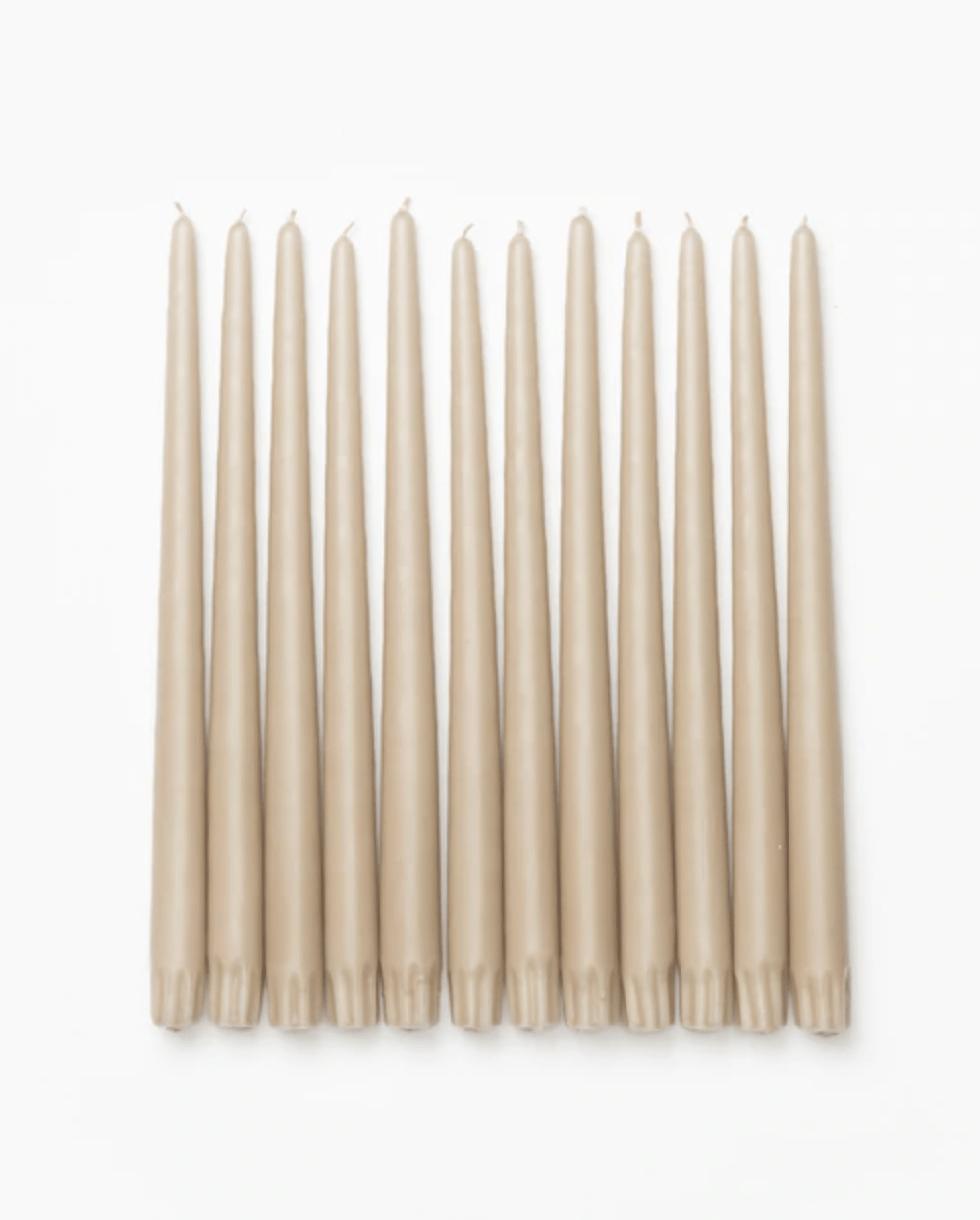12 sand-colored taper candles