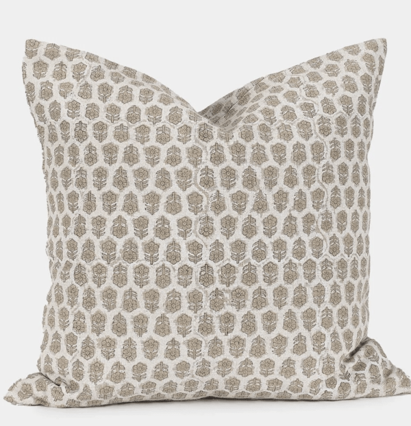 cream pillow with patterned flowers
