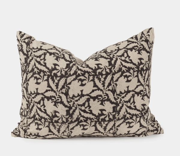 cream and black patterned pillow