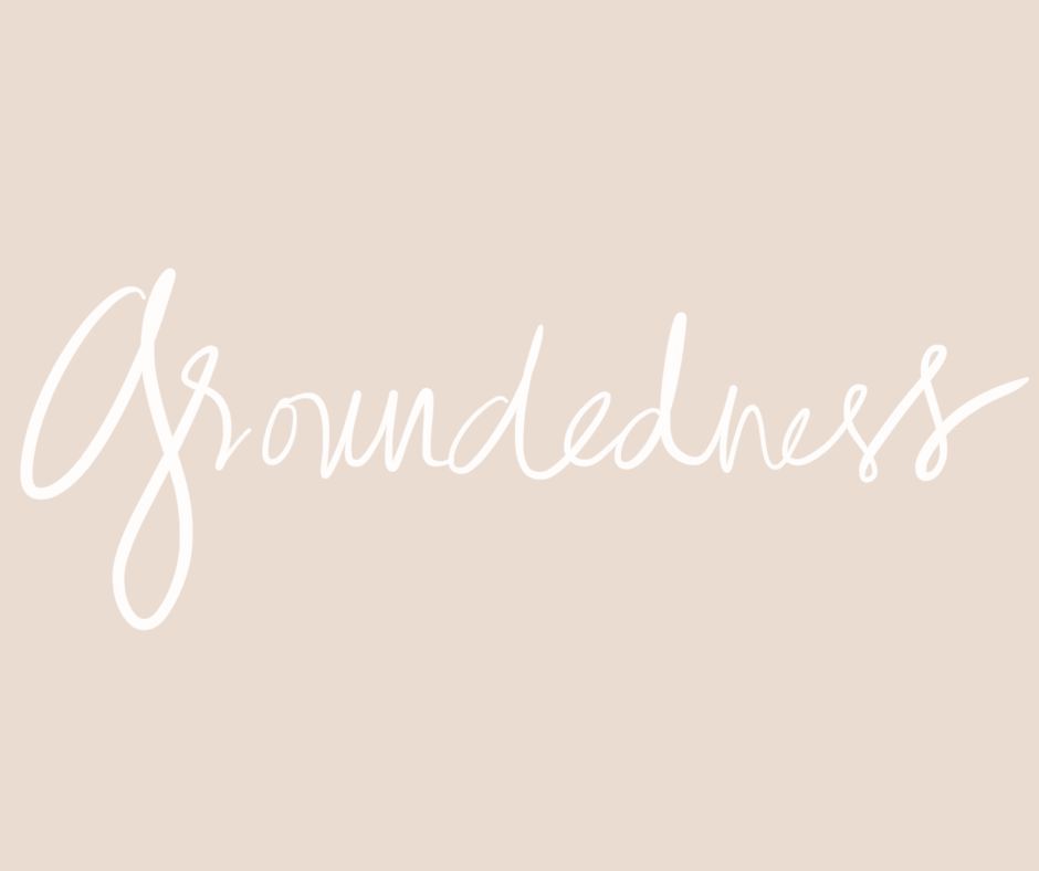 white handwriting on blush background that says "groundedness"