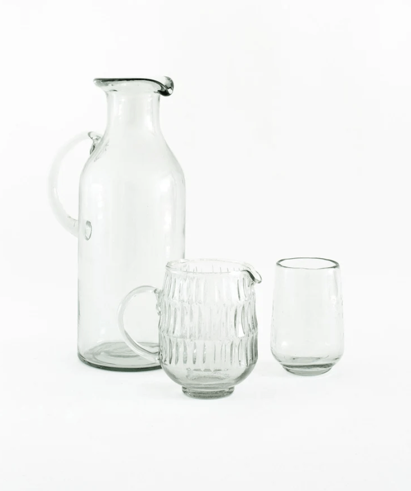 set of recycled glassware including large and small pitcher and drinking glass