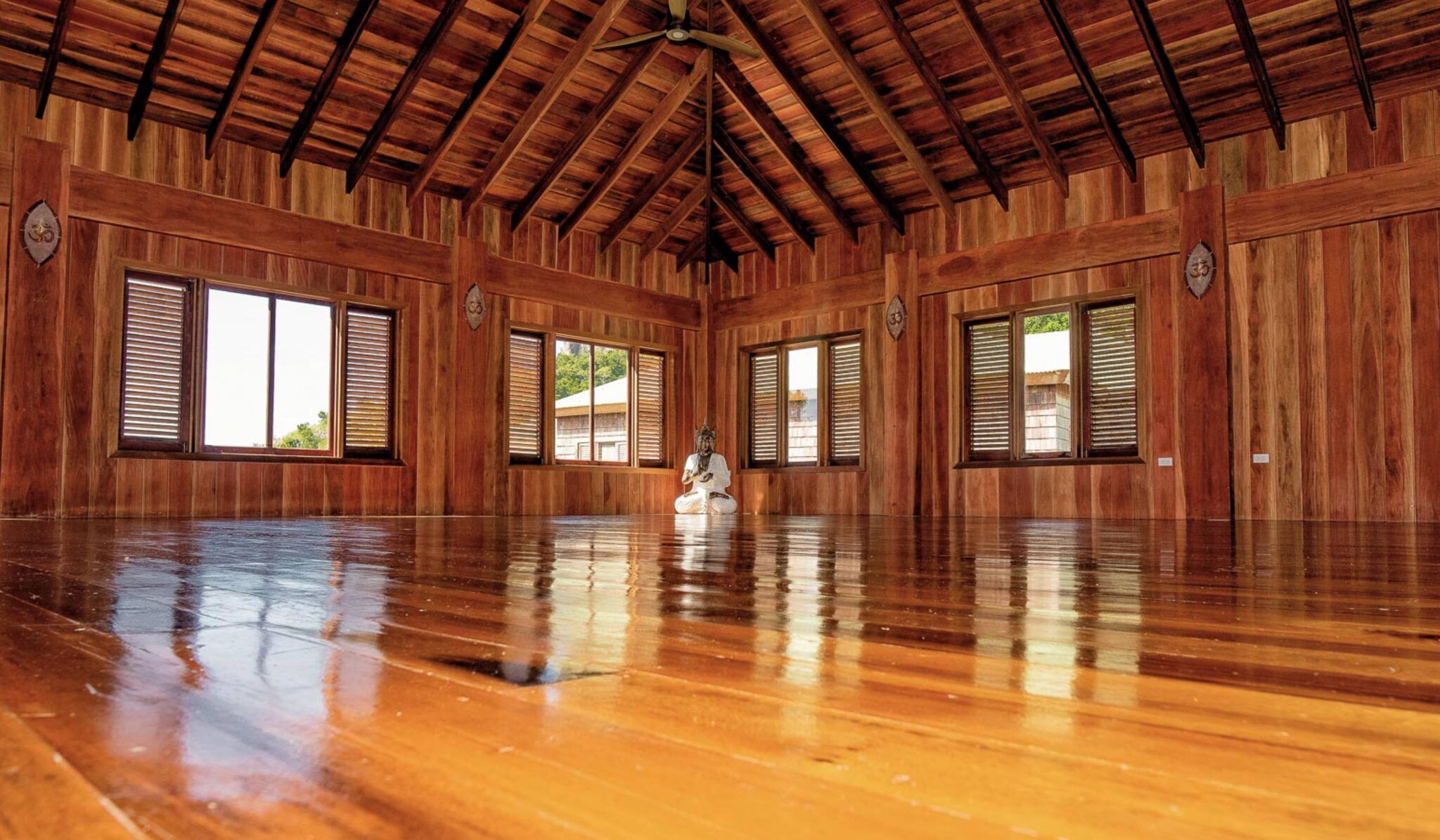 wooden yoga studio with buddha