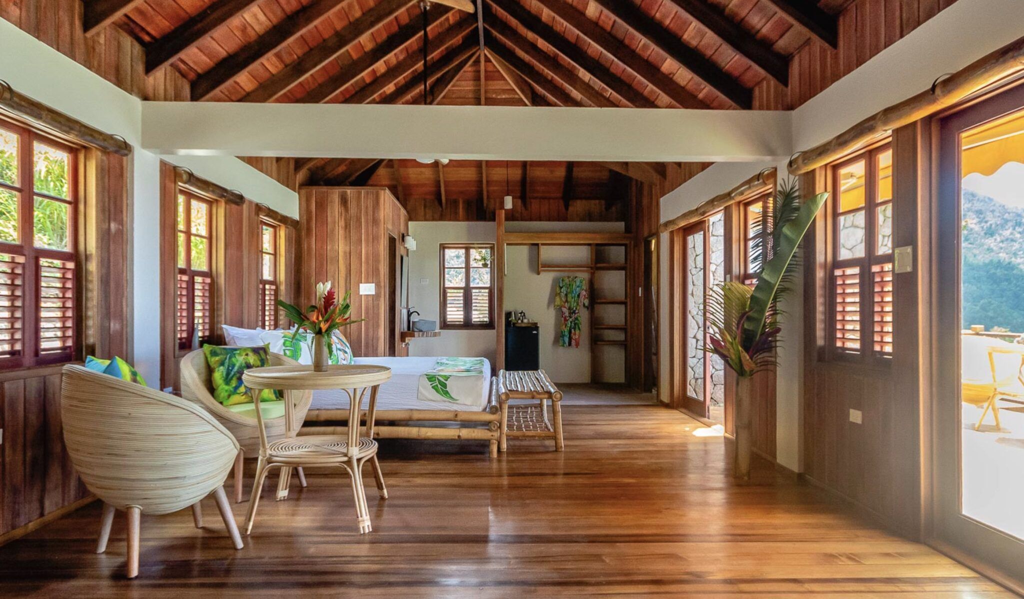 Suite at Jungle Bay in Dominica with wooden floor and ceiling, wood accents, bamboo furniture