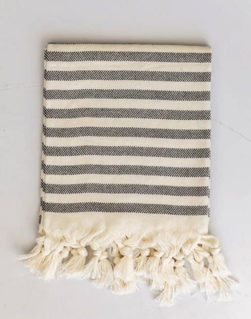 gray and cream striped hand towel with fringe on bottom