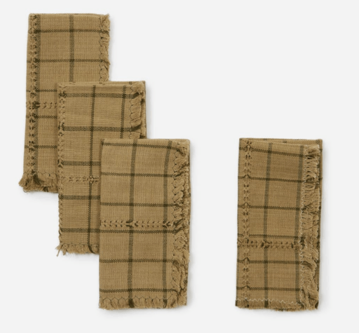 four checkered mustard-colored napkins